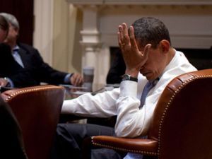 obama face in hand Barack Obama with face in hand